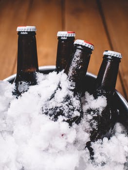cold beer bottles in a bucket